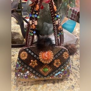 Boho Gypsy style beaded small purse with mink Pom Pom’s